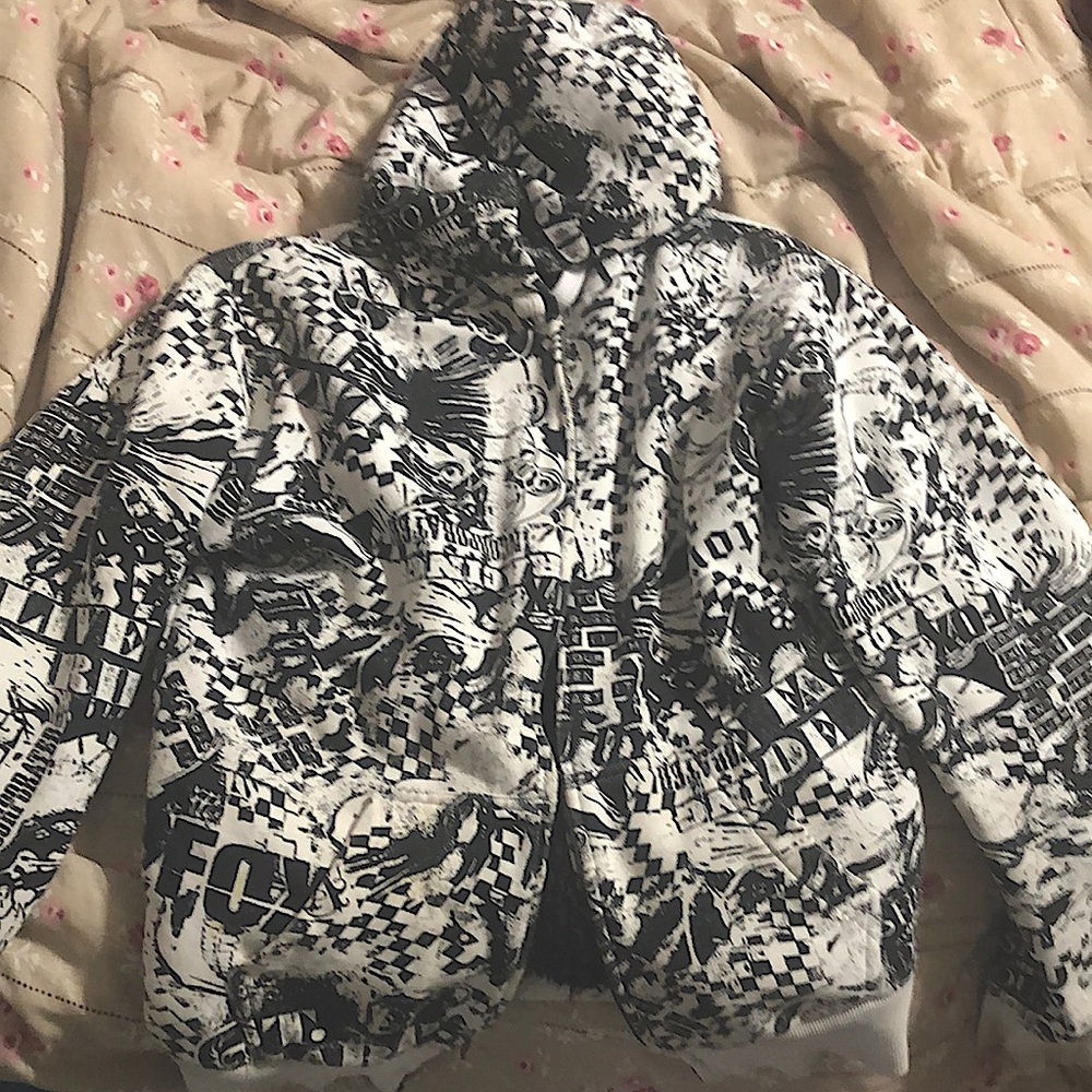 Fox Racing Jacket. Black and white various graphics such as skulls.